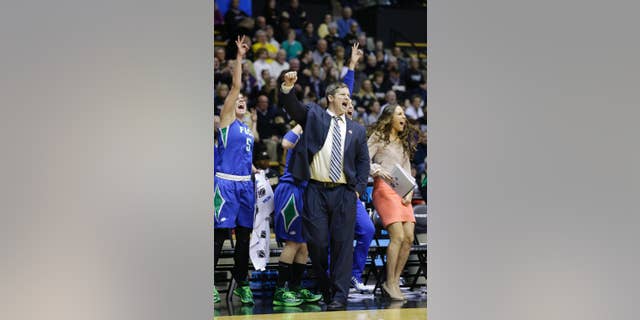 FILE - This March 22, 2014, file photo shows Florida Gulf Coast head coach Karl Smesko during the second half of a women's first round NCAA tournament college basketball game against Oklahoma State in West Lafayette, Ind. The Florida Gulf Coast coach with the tiny office has very quietly built a winning machine. (AP Photo/Michael Conroy, File)