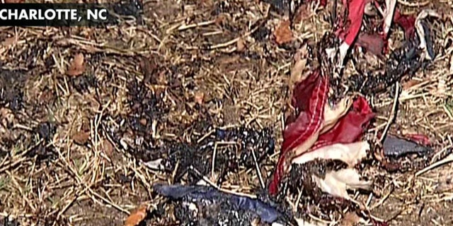 Police in Charlotte arrested four men after they reportedly set two American flags on fire Friday morning at an Occupy protest site.