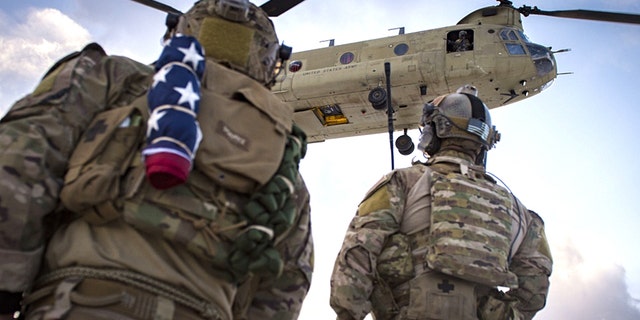 U.S. Air Force pararescuemen, assigned to the 83rd Expeditionary Rescue Squadron, prepare to board a U.S. Army CH-47F Chinook during a training mission in Afghanistan, March 15, 2018.