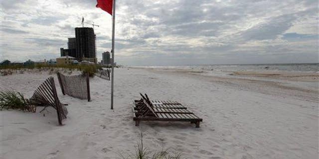 An empty beach is shown in Orange Beach, Ala.