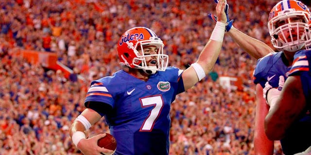 Sep 5, 2015; Gainesville, FL, USA; Florida Gators quarterback Will Grier (7) is congratulated as he runs the ball in for a touchdown against the New Mexico State Aggies during the second quarter at Ben Hill Griffin Stadium. Mandatory Credit: Kim Klement-USA TODAY Sports