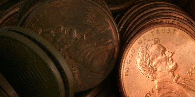 DES PLAINES, IL - JULY 06: Pennies lay in a pile July 6, 2006 in Des Plaines, Illinois. According to the U.S. Mint says a penny costs more to make than it's worth, 1.2 cents, prompting some to call for its demise. (Photo Illustration by Tim Boyle/Getty Images)