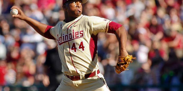FILE - In this March 2, 2014, file photo, Florida State relief pitcher Jameis Winston throws in the ninth inning of an NCAA college baseball game against Miami in Tallahassee, Fla. Winston put together the best pitching outing of his collegiate baseball career in the Seminoles’ 13-inning win against North Carolina State on Saturday, March 15, 2014. (AP Photo/Phil Sears, File)