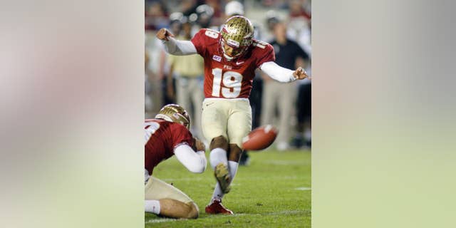 FILE - In this Saturday, Nov. 23, 2013 file photo, Florida State kicker Roberto Aguayo (19) ties an FBC record of 78 consecutive extra points in a season with this extra point in the fourth quarter of an NCAA college football game against Idaho in Tallahassee, Fla. Florida State’s Roberto Aguayo sometimes roots against the Seminoles’ offense. The thoughts aren’t selfish, just part of a mindset that has him poised to become the most accomplished kickers in school history and one of the best ever in college football, Thursday, Sept. 11, 2014. (AP Photo/Phil Sears, File)