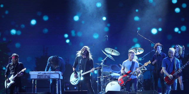 The Foo Fighters played a pickup soccer game with members of the University of Kentucky men's and women's soccer team.