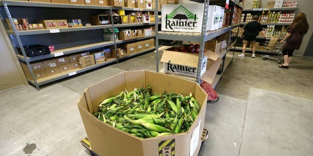 A load of sweet corn sits ready to be given away at the Des Moines Area Religious Council food pantry in Des Moines, Iowa, in July 2015.