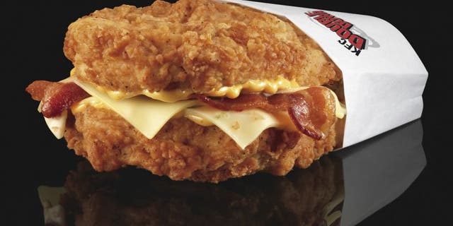 The Double Down is a sandwich with two chicken filets taking the place of bread slices. In between are two pieces of bacon, melted slices of Monterey Jack and Pepper Jack cheese and a zesty sauce.