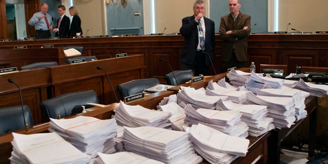 May 15, 2013: Stacks of paperwork await members of the House Agriculture Committee, on Capitol Hill in Washington, as it meets to consider proposals to the 2013 Farm Bill, including small cuts to the $80 billion-a-year food stamp program in an effort to appease conservatives who say the food aid has become too expensive.