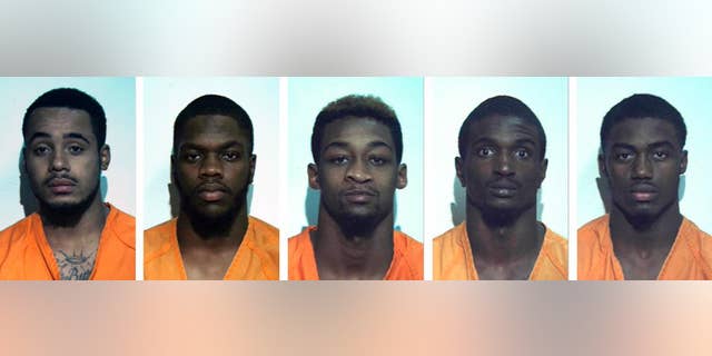 These undated photos provided by the Washington County, Pa. correctional facilty show, from left, Jonathan Barlow, D'Andre Dunkley, Corey Ford, Rodney Gillin Jr. and James Williamson. The five football players from the California University of Pennsylvania, in California, Pa., were arrrested and suspended from the school after police say they beat and stomped a man outside an off-campus restaurant, then fled yelling "Football strong!" The victim was in intensive care Friday, Oct. 31, 2014, with severe brain trauma. (AP Photo/Washington County, Pa. Correctional Facility)