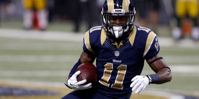 Aug. 17, 2013: In this file photo, St. Louis Rams wide receiver Tavon Austin runs with the ball during the second quarter of an NFL football game against the Green Bay Packers in St. Louis. The upcoming NFL season is driving tens of millions of people to make fantasy predictions about how America's most popular sport will play out.