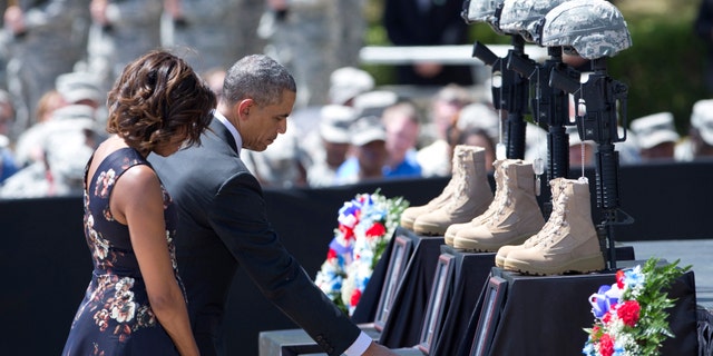President Obama pays his respect during a memorial ceremony, Wednesday, April 9, 2014, at Fort Hood Texas.