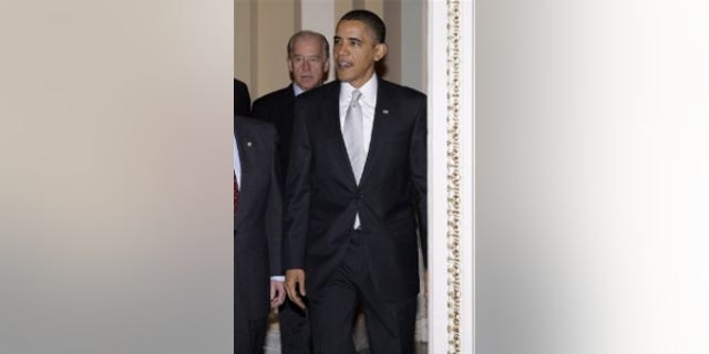 President Obama and Vice President Biden walk into the Senate Democratic caucus meeting on Capitol Hill(AP Photo)