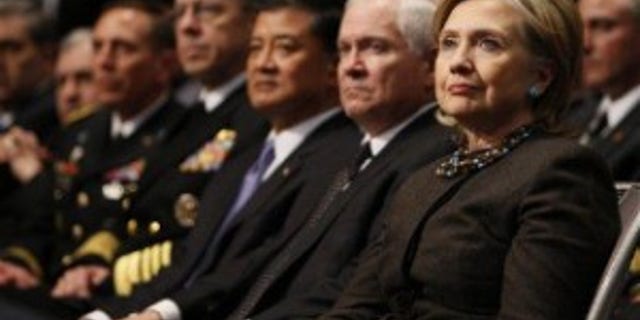 Secretary of State Hillary Clinton, right, and Defense Secretary Gates listen to President Obama's speech at U.S. Military Academy West Point (AP Photo)