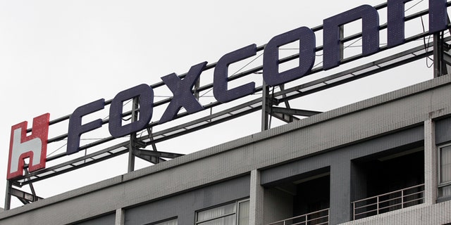 Dec. 24, 2013: The logo of Foxconn, the trading name of Hon Hai Precision Industry, is seen on top of the company's headquarters in Tucheng, New Taipei city.