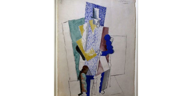 December 12, 2013: Picasso's 1914 cubist drawing L'homme au Gibus, Man with Opera Hat, is presented at Sotheby's auction house in Paris. (AP Photo)
