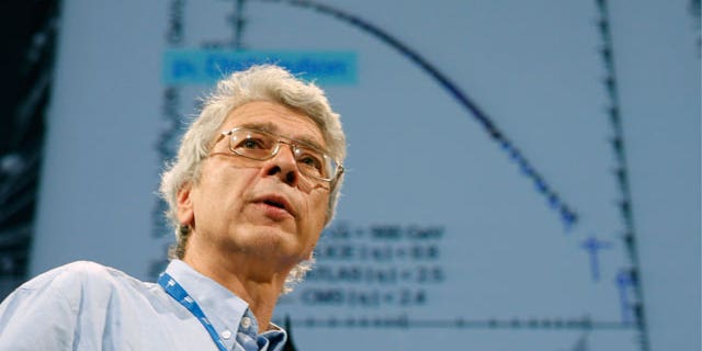 July 26: Dr. Juerg Schuknecht speaks to an audience of scientists during the 35th International Conference on High Energy Physics on the Alice experiment in Paris. International physicists announce today, some results from CERN, the European particle collider which aims at uncovering the secrets of the universe, and how the universe began. (AP)