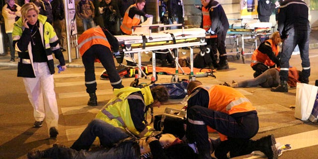 Dec. 21, 2014: This photo provided by local newspaper Le Bien Public shows rescue workers tending at victims after a driver deliberately slammed into passersby in several spots in Dijon, central France. (AP Photo/Christian Guileminot; Le Bien Public)