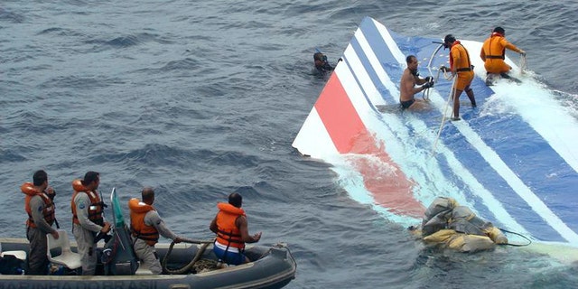 Brazil's Navy sailors recovering debris from the missing Air France jet at the Atlantic Ocean. Officials say flight recorders from an Air France plane that crashed nearly two years ago show that the captain only arrived in the cockpit after the plane had begun its fateful 3 1/2-minute descent. The initial findings of the French air accident investigation agency, the BEA, based on a reading of the so-called black boxes recovered from the ocean depths, found that the captain had been resting when the emergency began. All 228 aboard the Rio de Janeiro to Paris flight were killed on June 1, 2009.