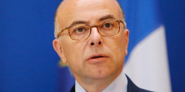French Interior Minister Bernard Cazeneuve addresses the media in Paris, Sunday, June 1, 2014. A suspected French jihadist who spent time in Syria is in custody over the shooting deaths of three people at a Belgian Jewish museum, prosecutors said Sunday, crystalizing fears that European radicals will parlay their experiences in Syria into terrorism back home. When Mehdi Nemmouche was arrested in southern France on Friday, he was in possession of firearms, a large quantity of ammunition and a video claiming responsibility for the May 24 attack, a Belgian prosecutor said. In a one-minute rampage that deeply shook Europe's Jewish community, a gunman opened fire at the Brussels museum. In addition to the fatalities, another person was gravely wounded. (AP Photo/Jacques Brinon)
