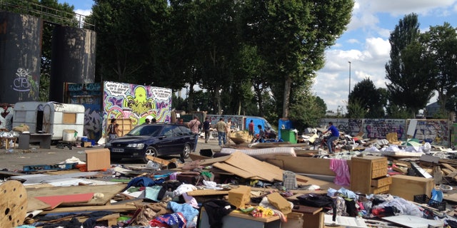 This is an image taken Thursday, Aug. 9, 2012 of the abandoned lot that Gypsies had made their home for five months in Gennevilliers, outside Paris, shortly after they learned the encampment would be demolished. The Gypsy camps lack electricity and running water. Grocery carts become makeshift grills. Rats run rampant and fleas gnaw on young and old alike. It's a life that modernity has bypassed, compounded by a dismal economy that has stretched from their homeland in Romania to a France that wants them to go somewhere anywhere else. (AP Photo/ Lori Hinnant )