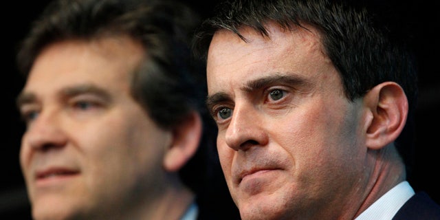April 10, 2014: This photo shows French prime minister Manuel Valls, right, and Economy Minister Arnaud Montebourg during a visit to French defense and electronic company Thales in Gennevilliers, outside Paris. (AP)