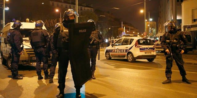 Nov. 18, 2015: Police forces prepare in Paris after reports of a shooting in the northern suburb of St. Denis.(AP Photo/Francois Mori)