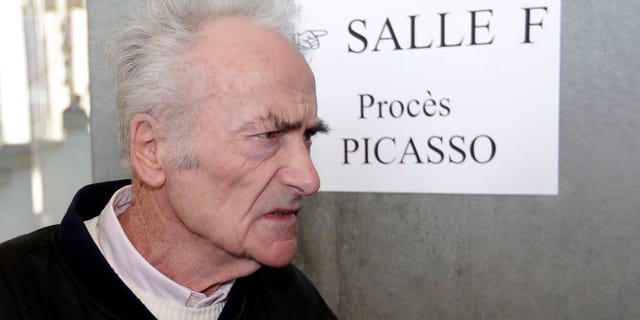 Pierre Le Guennec, 75, a retired electrician, arrives at Grasse criminal court, Tuesday, Feb. 10, 2015, in Grasse, southeastern France. Would Picasso have donated 271 works to an electrician who worked for him for a few years in southeast France? A French court began to contemplate that mystery on Tuesday at the start of a three-day trial of Pierre Le Guennec (Luh Gehn-EK) and his wife, Danielle. They claim that the artist, or his wife, gave them the 180 lithographs, collages and paintings and 91 drawings around 1970 when Le Guennec began working as a general handyman at Picasso's estate. (AP Photo/Lionel Cironneau)