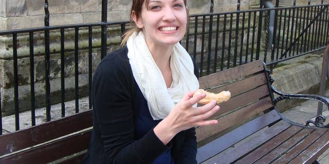 This photo provided by Xela Batchelder, shows Emily Selke as she enjoys a treat outside Fisher & Donaldson Bakery in St. Andrews, Scotland, on Aug. 1, 2013, on a excursion that was part of a study abroad with Drexel University and Fringe University. Selke, a recent Drexel University graduate and her mother, Yvonne Selke, were among the three Americans presumed dead in the plane crash in the southern French Alps, according to the U.S. State Department on Wednesday, March 25, 2015. (AP Photo/Xela Batchelder)