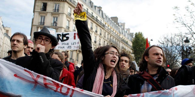 Oct. 26: Students shout slogans during a demonstration in front of the Senate in Paris. Nationwide protests and strikes over government moves to change the retirement age from 60 to 62 have disrupted French life and the country's economy for weeks, but the finance minister has declared that the slowing protest movement has reached a "turning point."