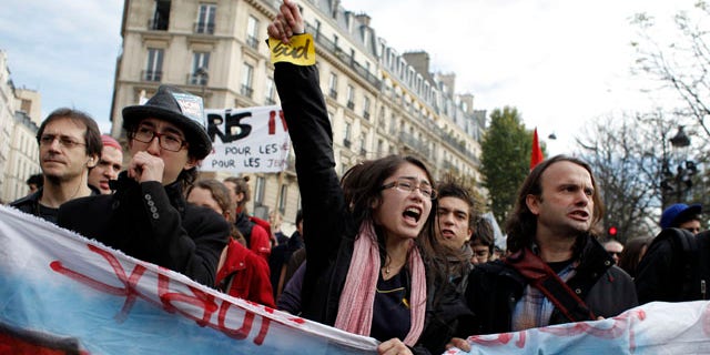 Oct. 26: Students shout slogans during a demonstration in front of the Senate in Paris. Nationwide protests and strikes over government moves to change the retirement age from 60 to 62 have disrupted French life and the country's economy for weeks, but the finance minister has declared that the slowing protest movement has reached a "turning point."