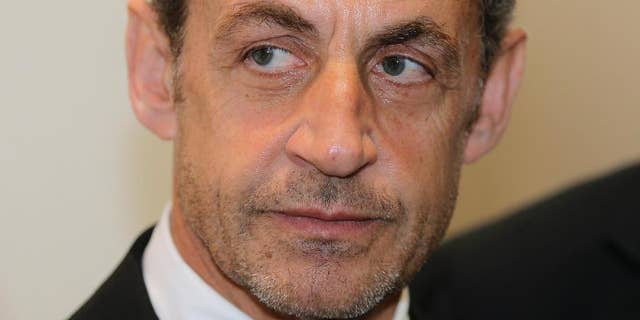 FILE - This Monday, March 10, 2014, file photo shows former French President Nicolas Sarkozy at the Foundation Claude Pompidou, in Nice, French Riviera. Former French President Nicolas Sarkozy has been detained and is reportedly being questioned by financial investigators in a corruption probe that is rattling France’s conservative political establishment. (AP Photo/Lionel Cironneau, File)