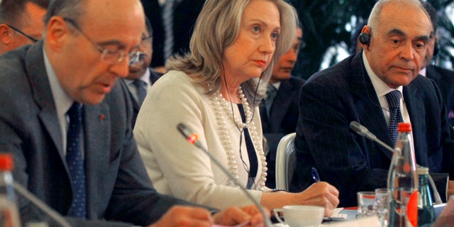 April 19: From left, France's foreign minister Alain Juppe, U.S Foreign Secretary Hillary Rodham Clinton, and Egyptian counterpart, Mohamed Kamel Amr, right, prior to the meeting with a delegation in Pari.