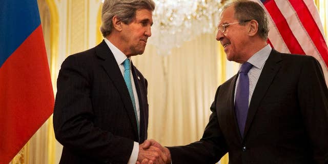U.S. Secretary of State John Kerry, left, shakes hands with Russian Foreign Minister Sergey Lavrov before the start of their meeting at the Russian Ambassador's residence about the situation in Ukraine, in Paris Sunday March 30, 2014. Kerry traveled to Paris for a last minute meeting with Lavrov. (AP Photo/Jacquelyn Martin, Pool)