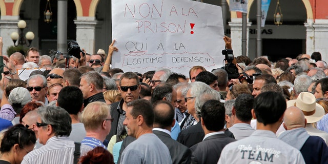 Sept. 16, 2013: Nice citizens, holden a banner writing "No in jail, Yes to self defense", take part in a rally supporting Stephan Turk in Nice southeastern France.