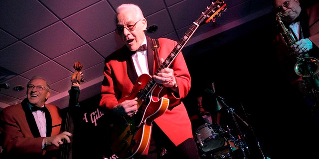This March 21, 2005 file photo shows members of The Comets, from left to right, Marshall Lytle, Franny Beecher, and Joey Ambrose perform at Rock is Fifty party held at the Gibson Guitar Studio in New York. Beecher, lead guitarist for Bill Haley and the Comets, died Monday, Feb. 25, 2014.
