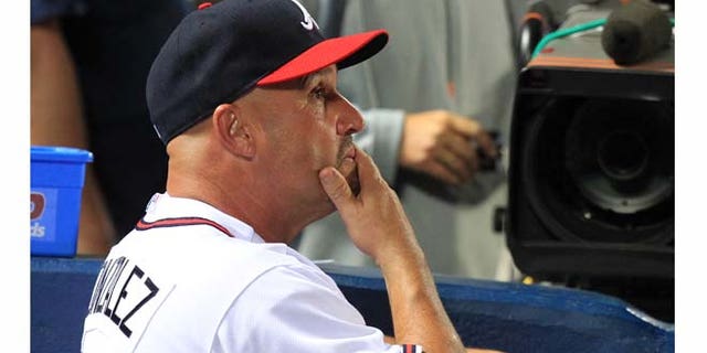 Atlanta Braves manager Fredi Gonzalez watches in the late innings of the team's 4-3 loss to the Philadelphia Phillies in a baseball game at Turner Field in Atlanta on Wednesday, Sept. 28, 2011. (AP Photo/Atlanta Journal-Constitution, Curtis Compton) GWINNETT OUT MARIETTA OUT