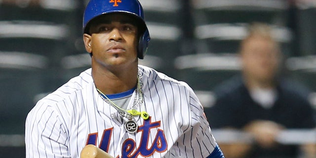 FILE - In this Sept. 20, 2016, file photo, New York Mets' Yoenis Cespedes reacts after striking out swinging for the final out in the Mets' 5-4 loss to the Atlanta Braves in a baseball game in New York. Cespdes is expected to opt out of the remainder of his contract, which would pay $47.5 million over two seasons, and become a free agent again. (AP Photo/Kathy Willens, File)