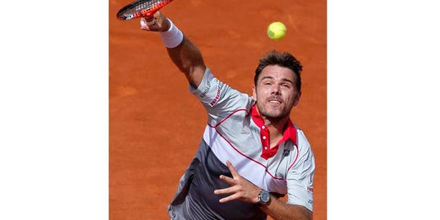 June 7, 2015: Switzerland's Stan Wawrinka serves the ball to Serbia's Novak Djokovic during their final match of the French Open tennis tournament at the Roland Garros stadium in Paris.