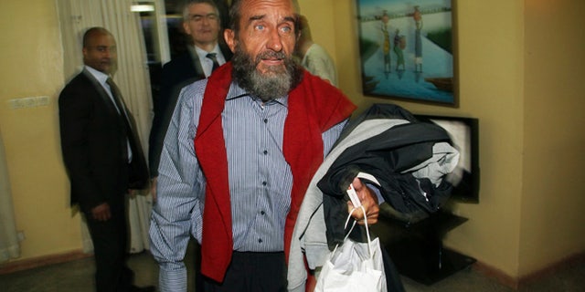 Oct. 30, 2013: Daniel Larribe, one of four Frenchmen held hostage by Al Qaeda militants for three years in the African Sahel, walks at the airport in Niamey, Niger.