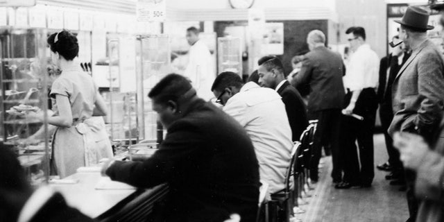 February 1960: People take part in a civil rights "sit-in" protest at the lunch counter in McCrory's in Rock Hill, S.C.