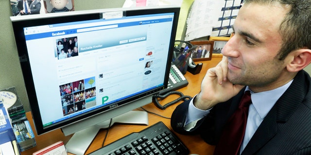 May 9, 2013: Joshua Knoller, an account manager with Nicholas & Lence Communications, looks at the Facebook page of his mother, Rochelle Knoller of Fair Lawn, N.J., on his office computer, in New York. Knoller spent years refusing his mothers "Friend Request" on Facebook before eventually "caving in."