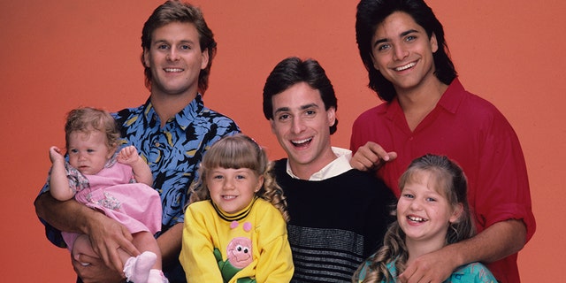 Candace Cameron Bure (front right) starred in ‘Full House’ as DJ Tanner, the daughter of Bob Saget's (center) Danny Tanner.