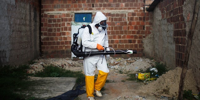 RECIFE, BRAZIL - FEBRUARY 04: A city worker fumigates in an effort to eradicate the mosquito which transmits the Zika virus on February 4, 2016 in Recife, Pernambuco state, Brazil. Officials say as many as 100,000 people may have already been exposed to the Zika virus in Recife, which is being called the epicenter of the crisis, although most never develop symptoms. Tourists are arriving in the city for its famed Carnival celebrations which begin tomorrow. (Photo by Mario Tama/Getty Images)