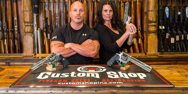 Lou Tuminaro and his wife Theresa of "The Gunfather" pose in their Hamilton, Montana store The Custom Shop.