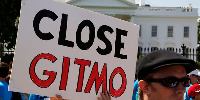 FILE: May 23, 2014: Activist holds a sign at a rally next to the White House in Washington, D.C.
