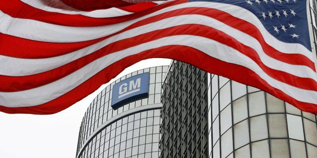 FILE: An American flag flies in front of the General Motors Global Headquarters in Detroit, Mich. (AP)