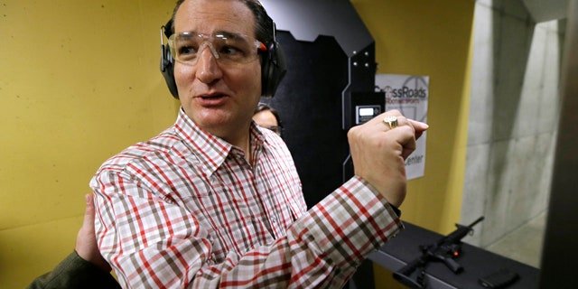 June 20, 2015: Republican presidential candidate, Sen. Ted Cruz, R-Texas, reacts after shooting a Smith & Wesson M-15 at the CrossRoads Shooting Sports in Johnston, Iowa. (AP Photo/Charlie Neibergall)