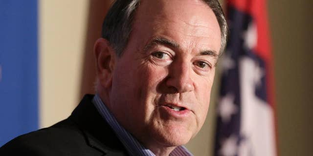 FILE - In this Aug. 24, 2015, file photo, former Arkansas Governor and Republican presidential candidate Mike Huckabee speaks to reporters in Little Rock, Ark. Huckabee is scheduled to visit a Kentucky jail next week to meet with a county clerk imprisoned because she ignored repeated court orders to issue marriage licenses to gay couples. Huckabee, a Baptist pastor, plans to host a rally in county clerk Kim Davis’ honor after the private meeting outside the Carter County Detention Center.(AP Photo/Danny Johnston, File)