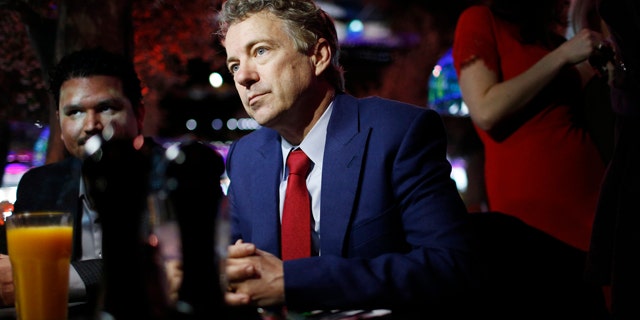 FILE - In this Jan. 16, 2015 file photo, Sen. Rand Paul, R-Ky.speaks with people at a restaurant in Las Vegas. (AP Photo/John Locher, File)