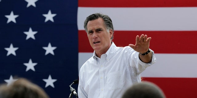 Mitt Romney, the former Republican presidential nominee, addresses a crowd of supporters while introducing New Hampshire Senate candidate Scott Brown at a farm in Stratham, N.H.